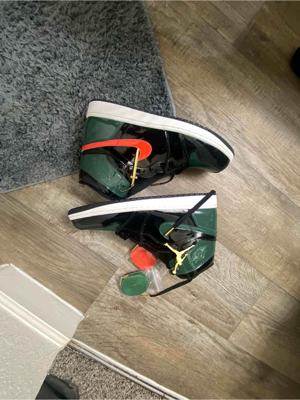 Jordan 1’s Men’s High-Top Sneakers in Green, Black & Orange